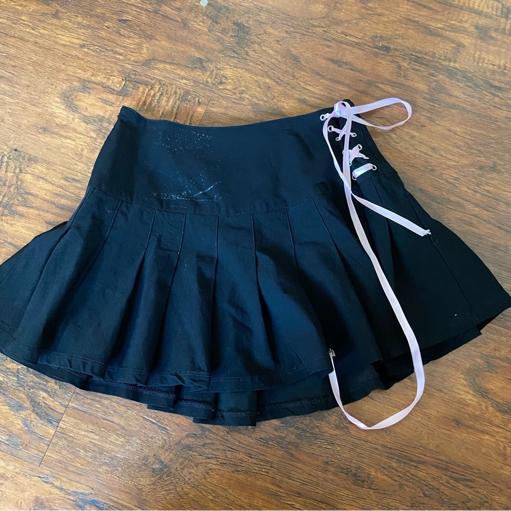 Sugar thrillz black pleated mini skirt with pink tie bows.